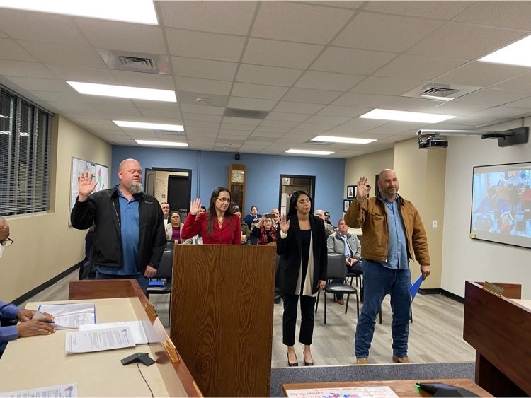 From left, Jimmy Meader, Cori Hillsman Vahalik, Perla Mariela Aguilar and Scott Hartman take their oaths of office at a Nov. 21 meeting of the Royal ISD Board of Trustees.